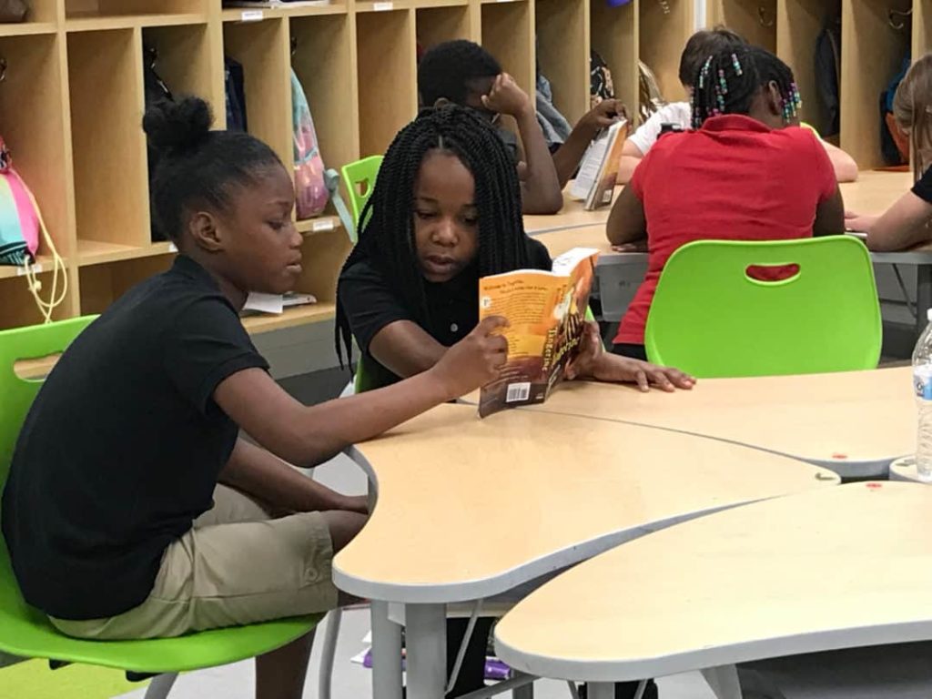 Students in Mr. Voss’s fourth grade class doing a shared reading of Tangerine.
