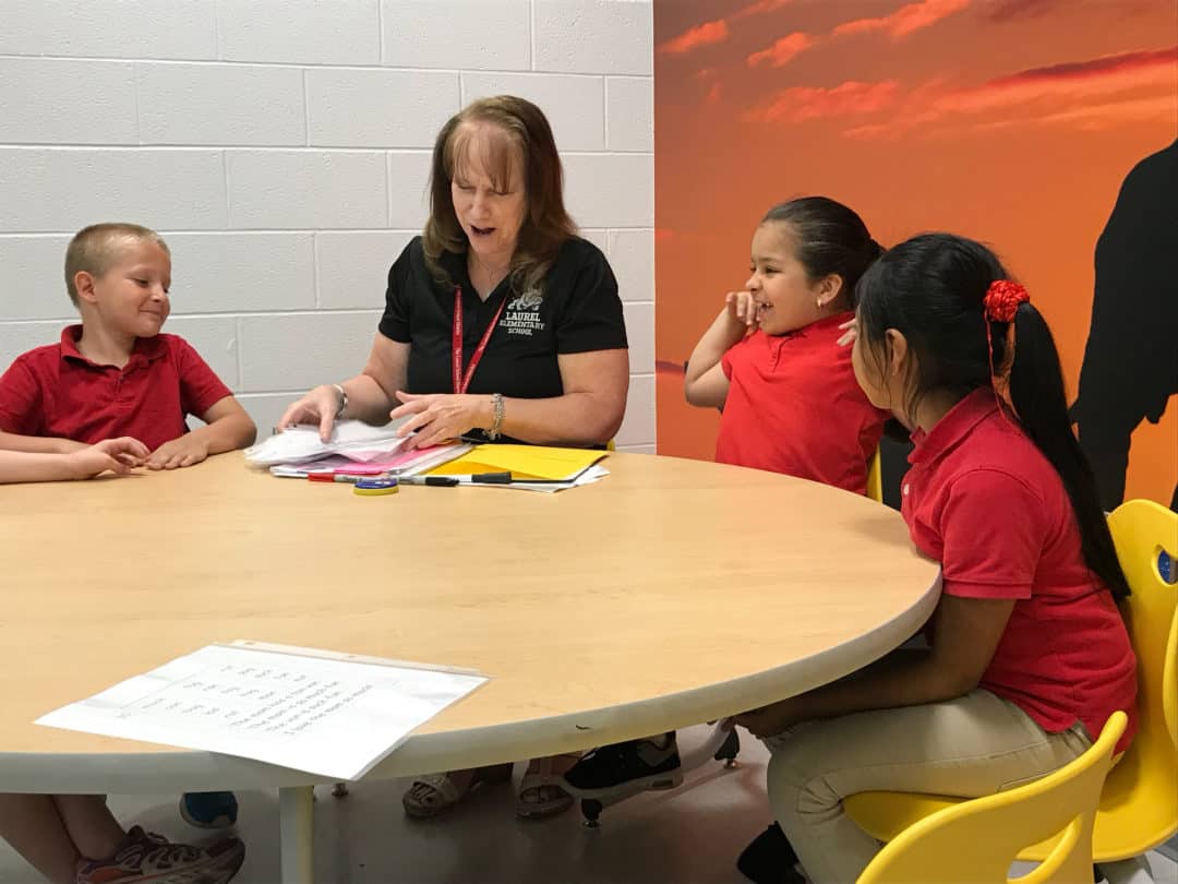 Reading specialist Sue Darnell working with a group of students on phonics during Differentiated Instruction.